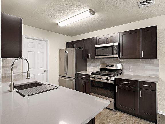 Fully remodeled kitchen! New cabinets, quartz countertops, brand new stainless steel appliances, new backsplash and sink!