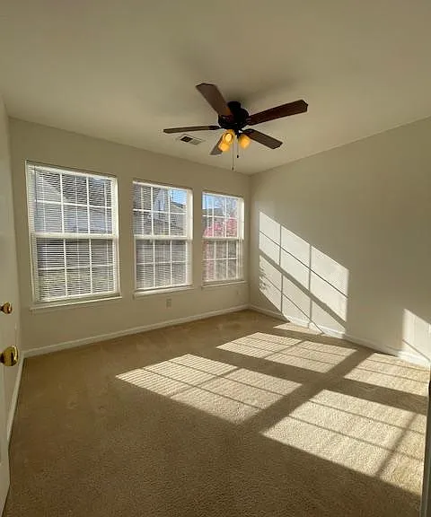 First bedroom offers wonderful natural light, ceiling fan and closet.