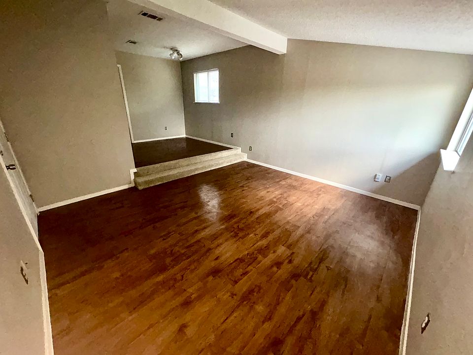 Living room facing dining/office area.