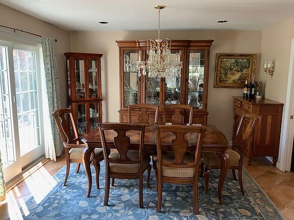 Dining room off of living room with sliding door to pool and patio.jpeg