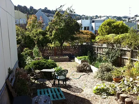 More of a cottage garden with small deck, and wildflowers everywhere. Gardening encouraged.