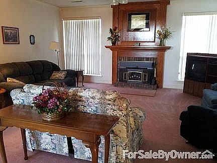 Living Room 						:						You can see the large windows but not the two large matching built-in bookcases