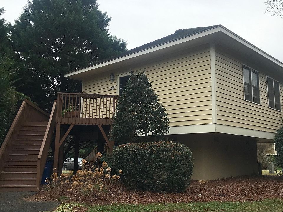 Outside of the home. Private walkway to staircase & porch.