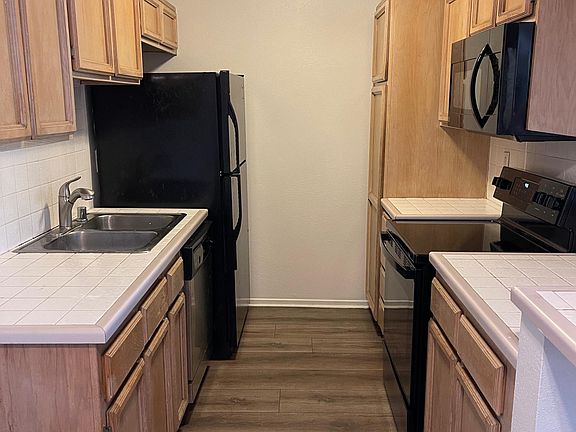 Kitchen with new floors, faucet and oven