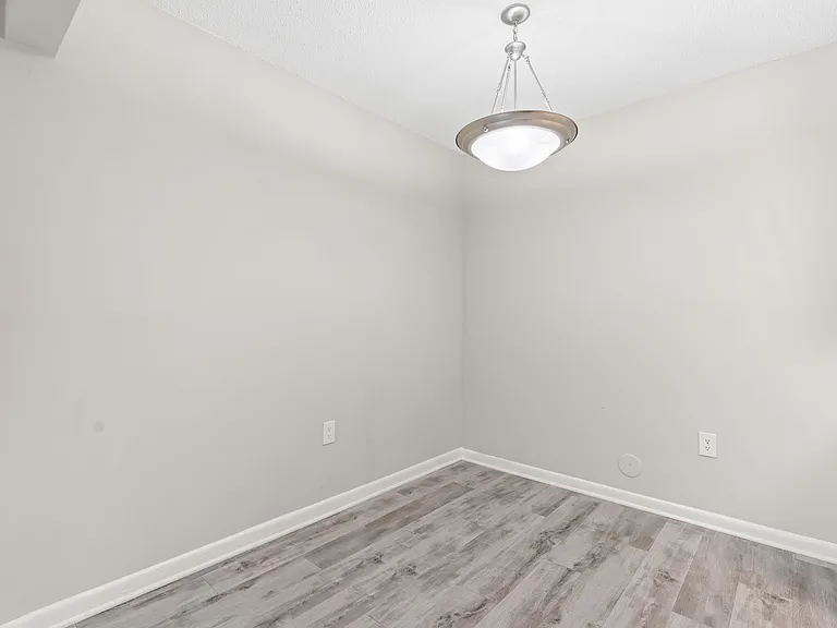Platinum Home Dining Room with Wood Style Flooring