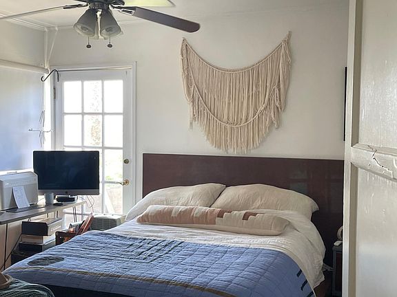 Bedroom with door leading to deck