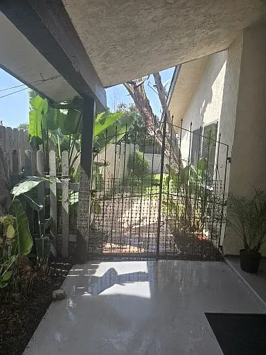 Gate tp backyard off of the entry porch