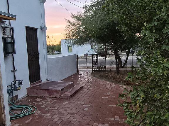 paver patio looking toward entry gate