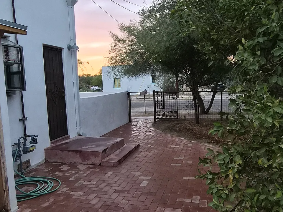 paver patio looking toward entry gate