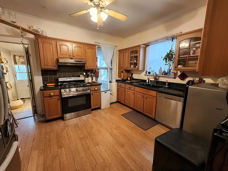Kitchen with solid wood cabinetry and stainless appliances