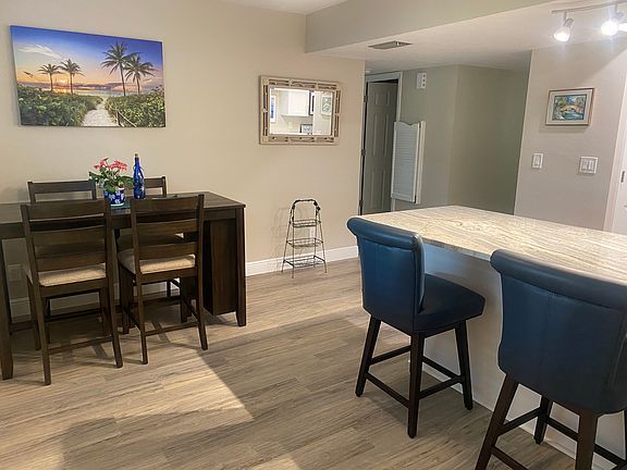 Entrance/breakfast area, door on left leads to guest area and laundry room