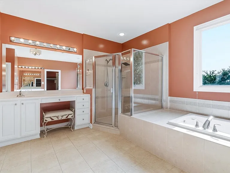 Seperate vanities, large walk in shower and bath tub