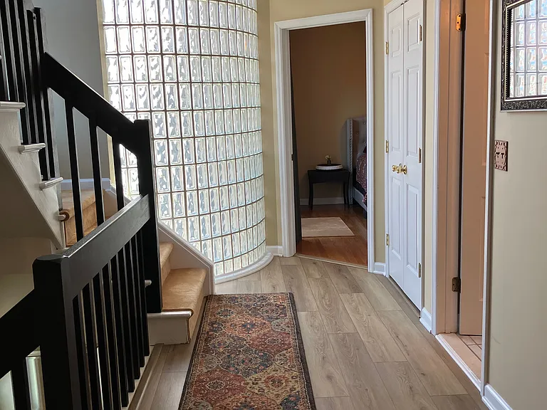 2nd floor hall. Living room, washer and dryer, full bath with tub and bedroom on this floor