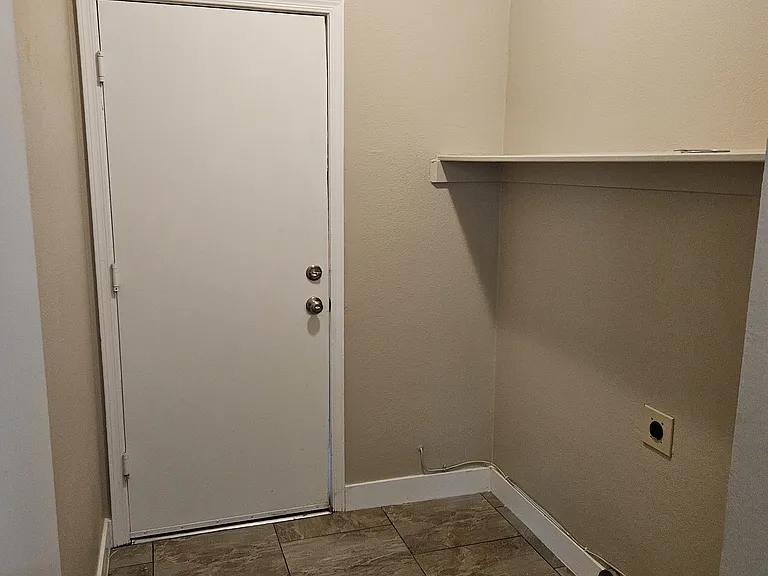 Washer and Dryer room - door to 2 car garage.