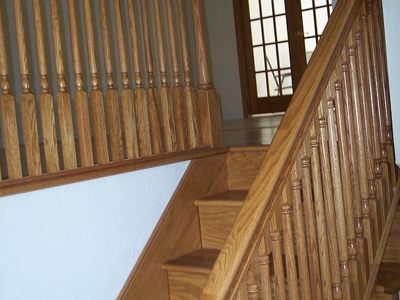 Steps from foyer leading up to kitchen and living room