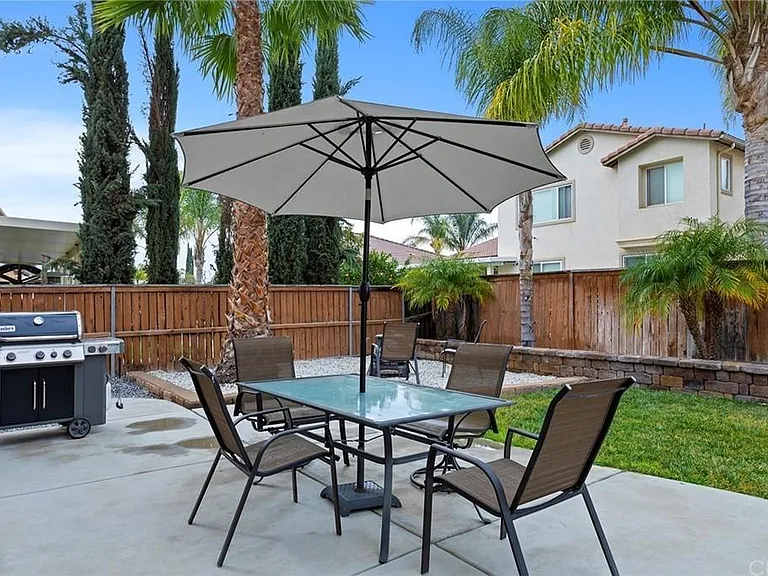 Backyard with ample seating/entertainment space.