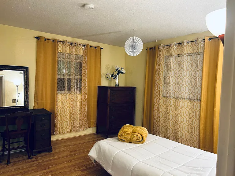 Twin size bedroom with office desk