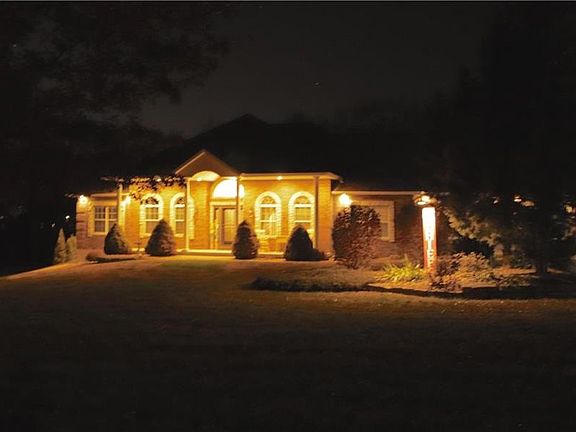 Notice that the garage door and driveway are also well lit.