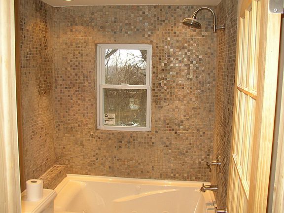 Mosic slate tiles on shower wall 