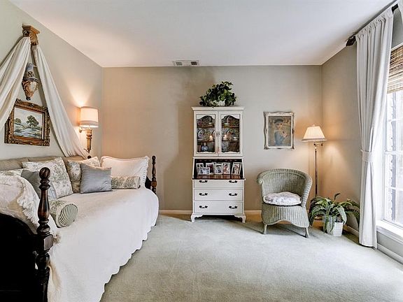 Opposite the formal dining room is a room that is being used as a reading room currently.  This is a flexible area and could be used for anything.  Carpet flooring and natural light make it warm and inviting.