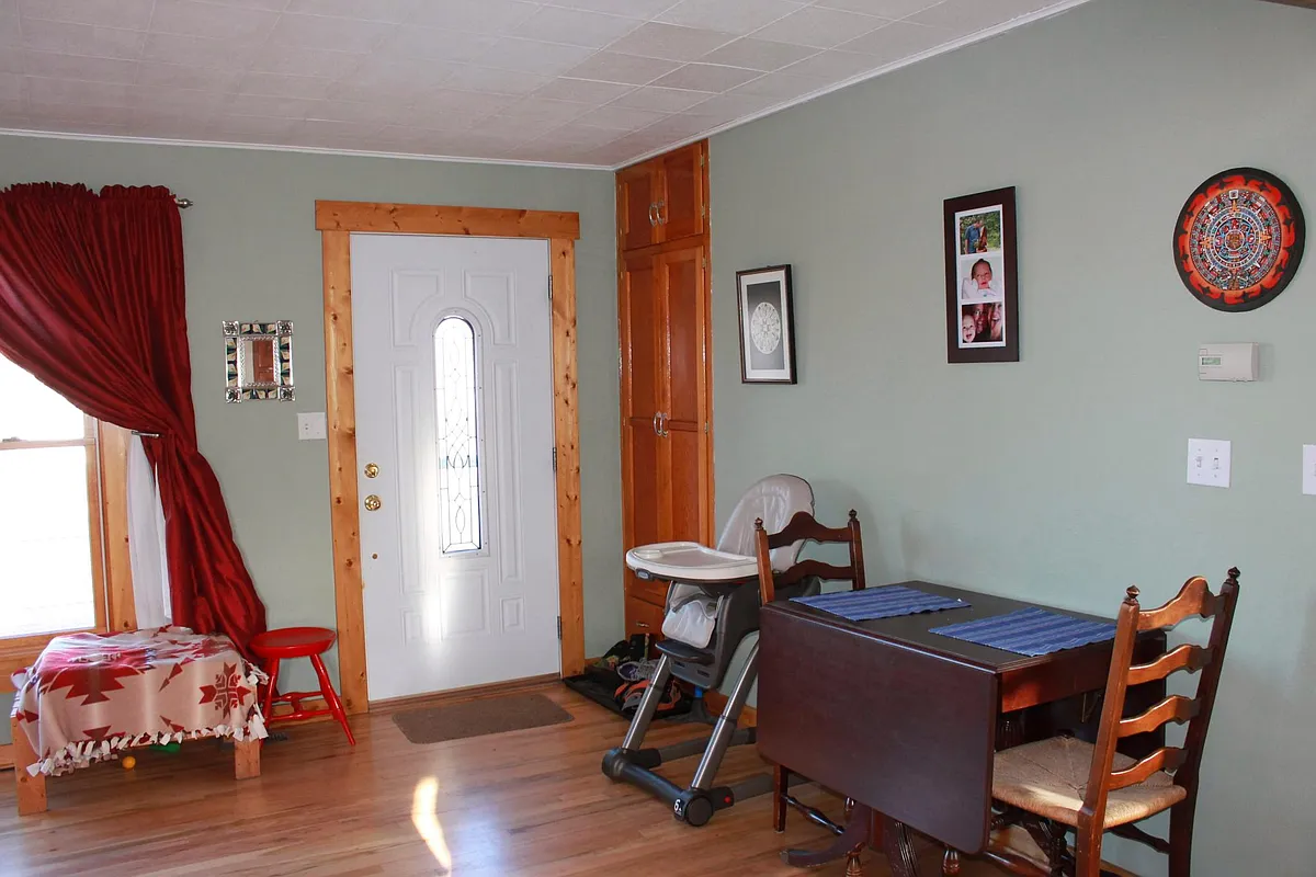 Open concept living/dining/kitchen area. - S 15th St