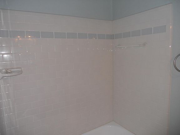 New tile in bathtub/shower.