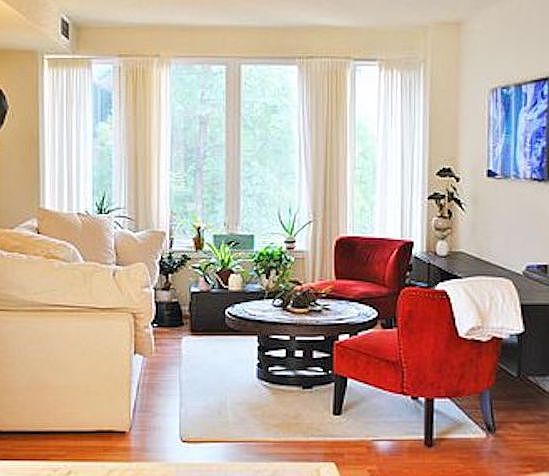 Sunlit living room offers various ways to arrange entertainment and seating areas