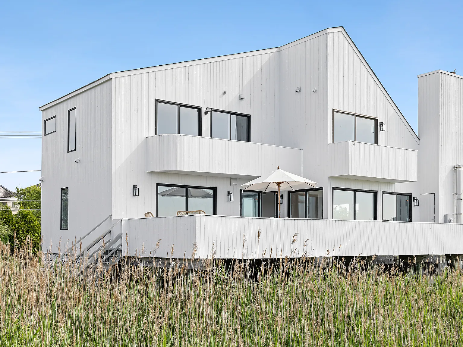 Dune Rd Waterfront | Dock, Beach Access, Sunset Views — Photo 4