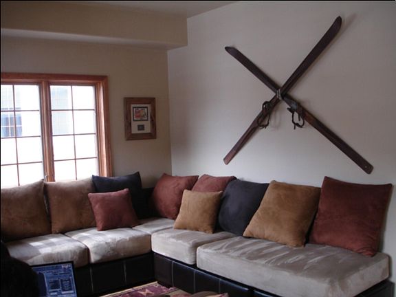 First level downstairs den area this level contains a bedroom with full bath and laundry room with washer/drier, larger hallway closet, utility with storage area and wrap around deck