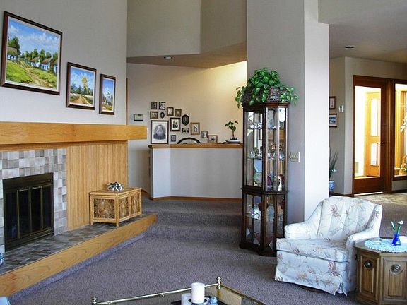 Vaulted ceilings and full wall fireplace grace the formal areas in the hearth room!