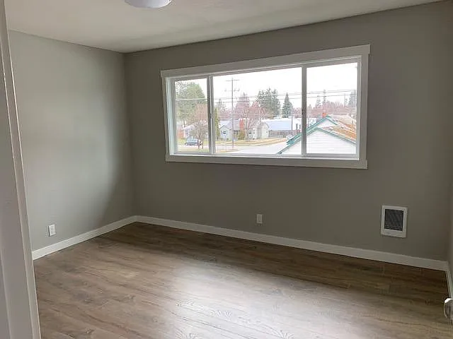 Bedroom with large window for nice natural light and hard surfaces. Nice walk in closet.