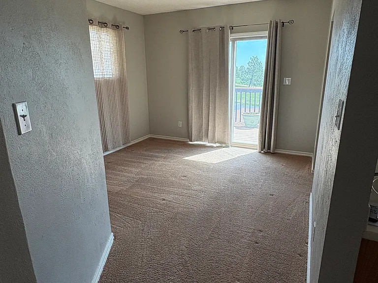 Primary Bedroom w-sliding glass door to upper deck