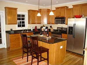 Hardoods, stainless appliances and granite...nice!