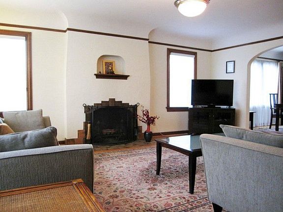 Grand formal living room with lots of natural light.