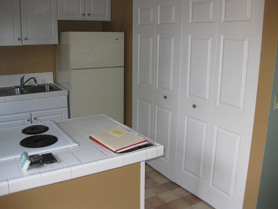 Kitchen showing washer/dryer cabinet