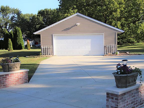 GARAGE IS 24 BY 40. A NICE 57 CHEVROLET WOULD LOVE IT IN THERE