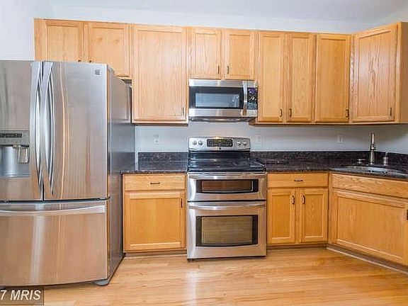 Kitchen has stainless steel appliances.