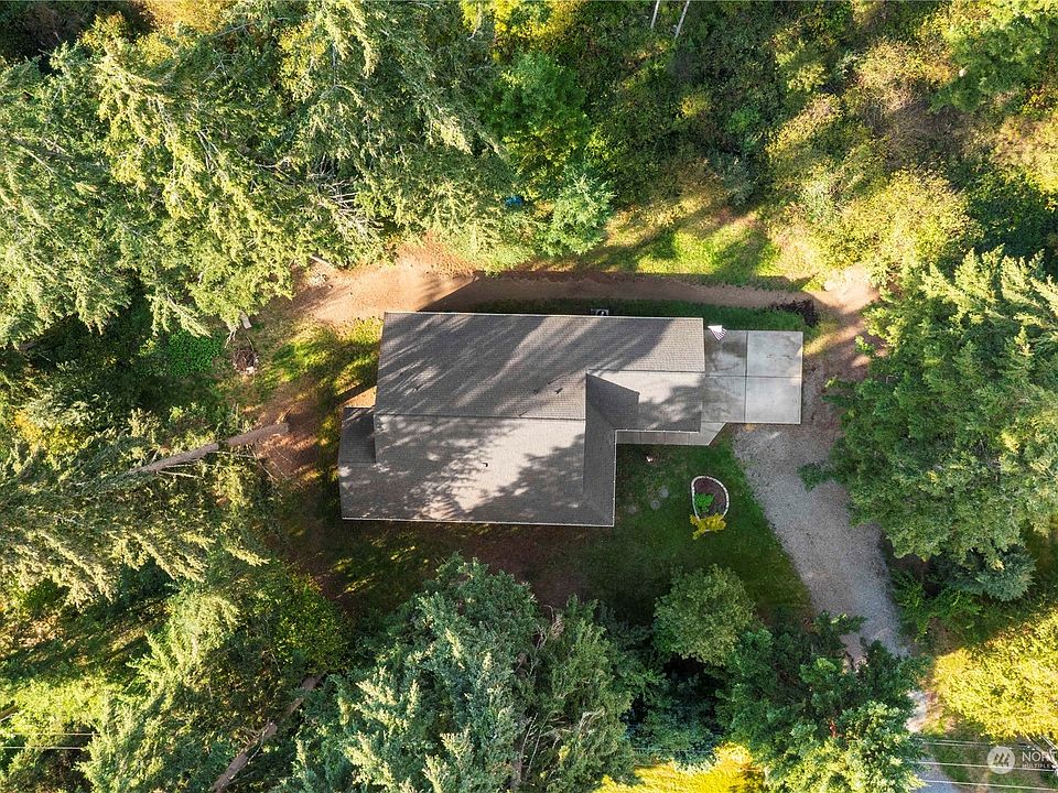 Surrounded by trees at end of private road>