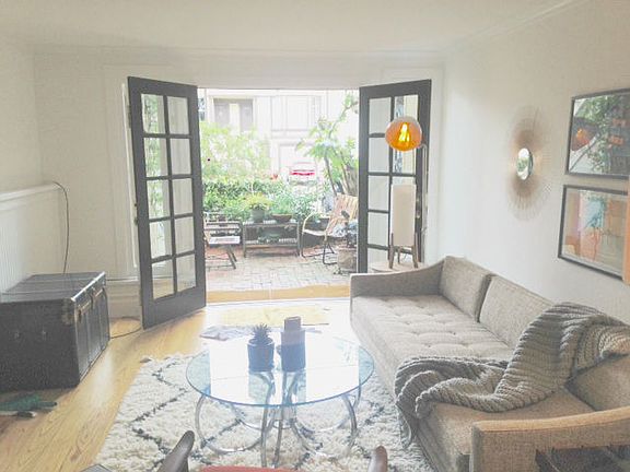 Den opens to front patio
