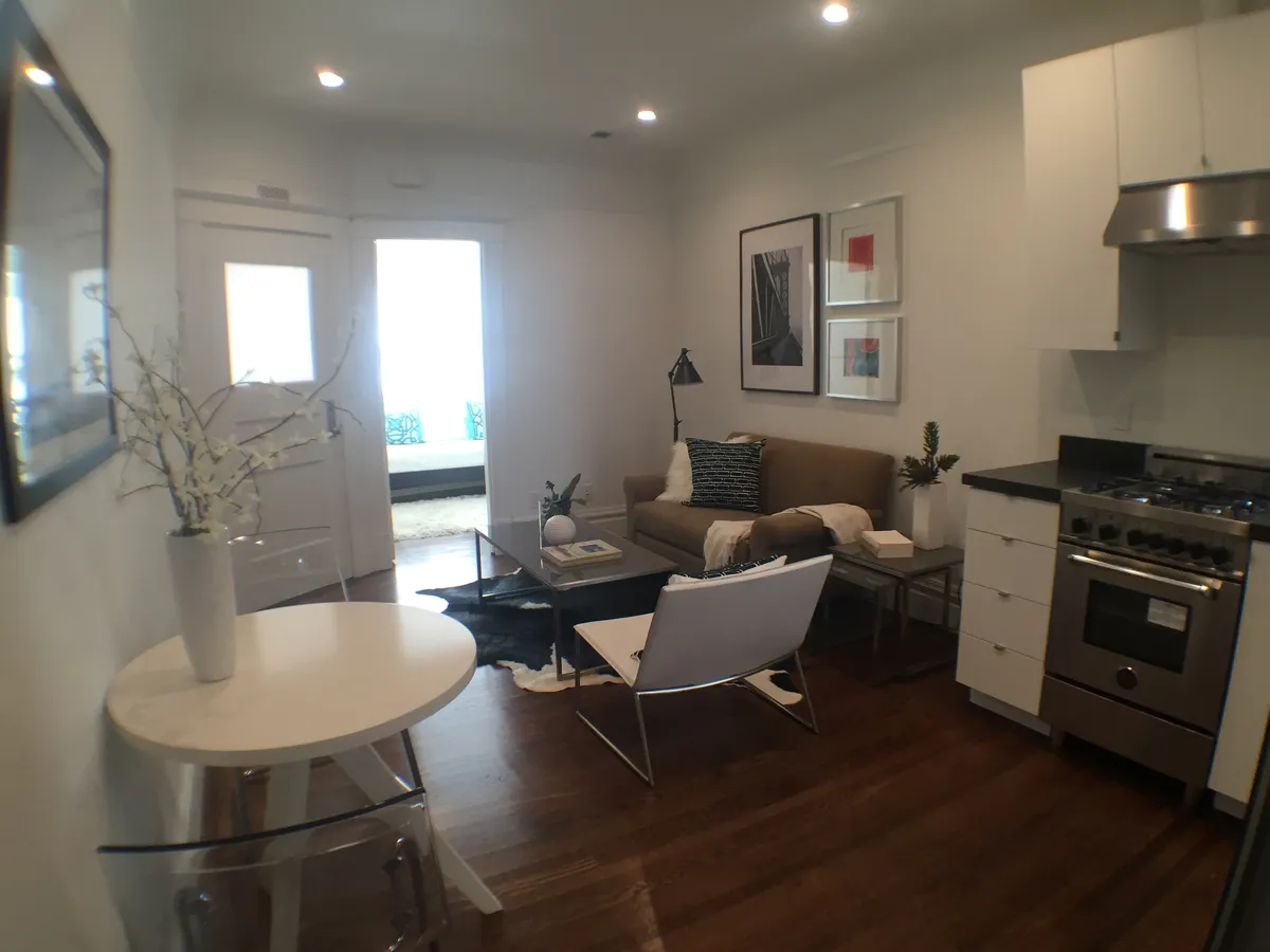 View of living room, front door, and front bedroom - 1130 Pacific Ave