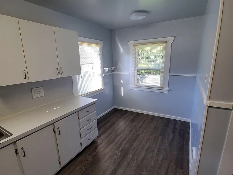 Small breakfast nook at the back of the kitchen. Tenants may move in their own refrigerator or owners will provide one.