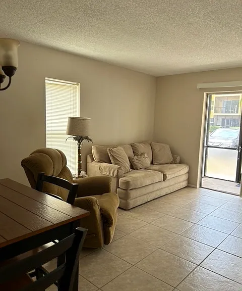 living room with sofa sleeper, recliner and TV stand