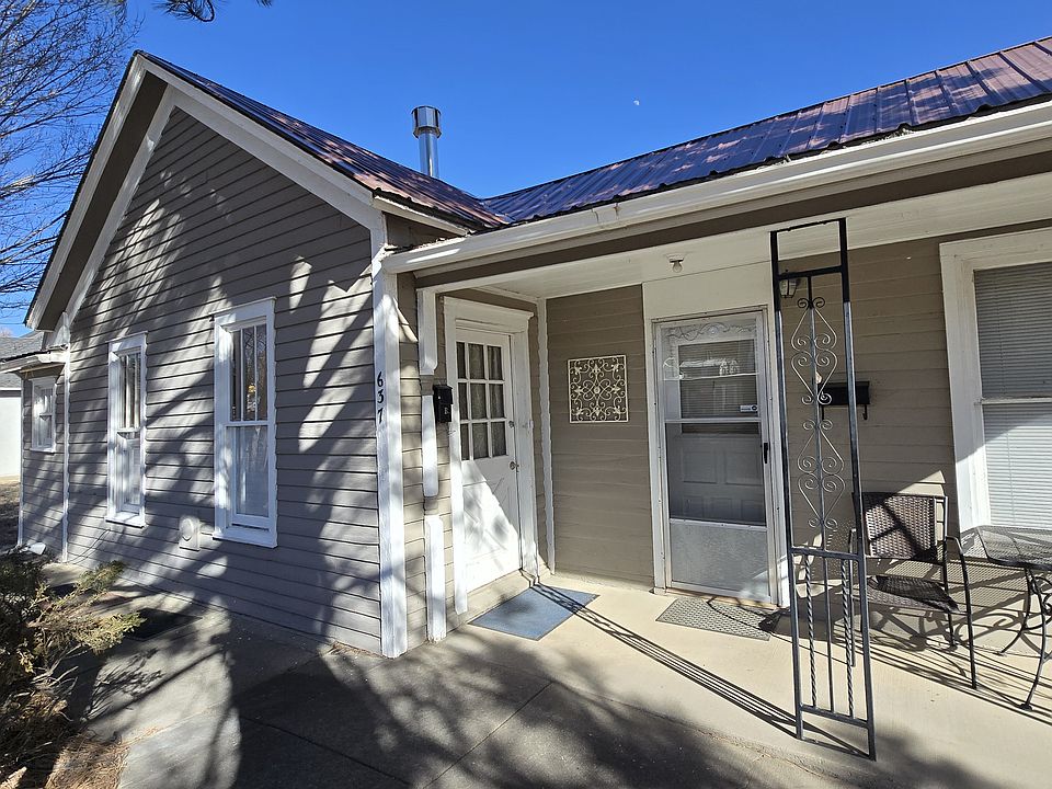 Front porch with table and two chairs