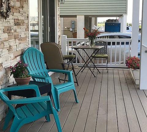 Porch looking at the house next door, toward the bay.