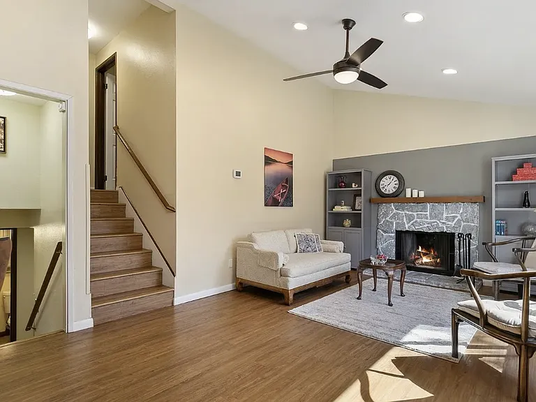 Living room with stairs leading to upper level.