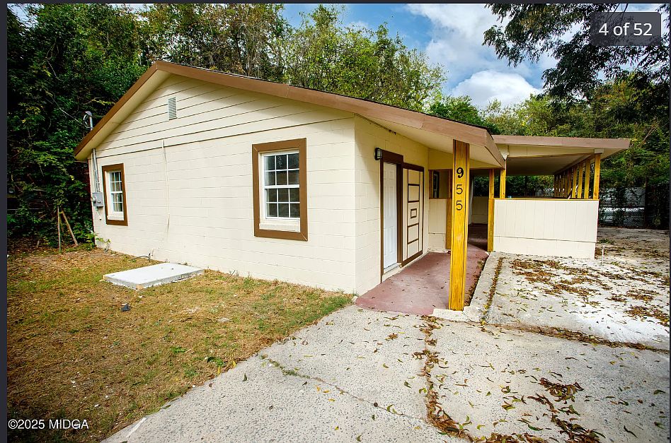 A cozy, well-maintained home featuring a welcoming front porch, private driveway, and spacious yardperfect for comfortable everyday living.