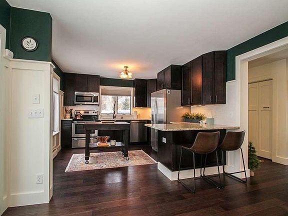 Kitchen with island and bar