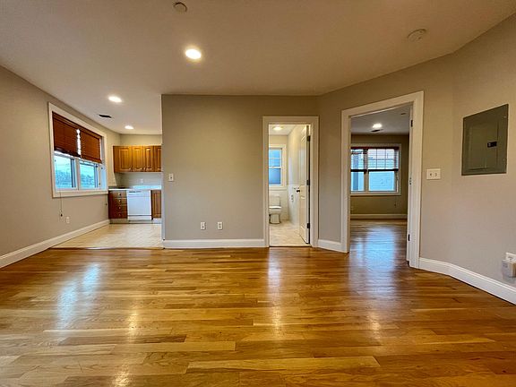 Living space view towards kitchen, bath and bedroom