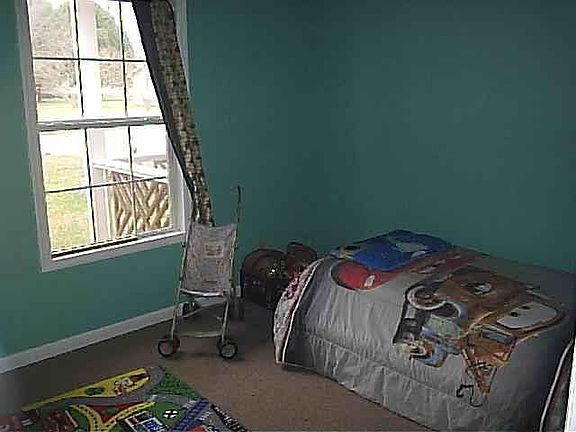 Bedroom 3 with metal locking closet door for safety items