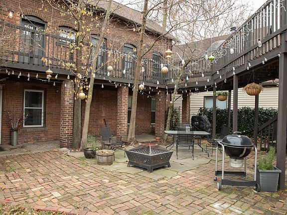 courtyard with fire pit, grill, and smoker